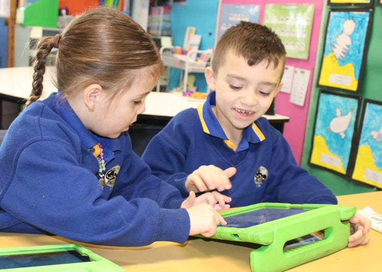 Students learning in a bright and colourful classroom