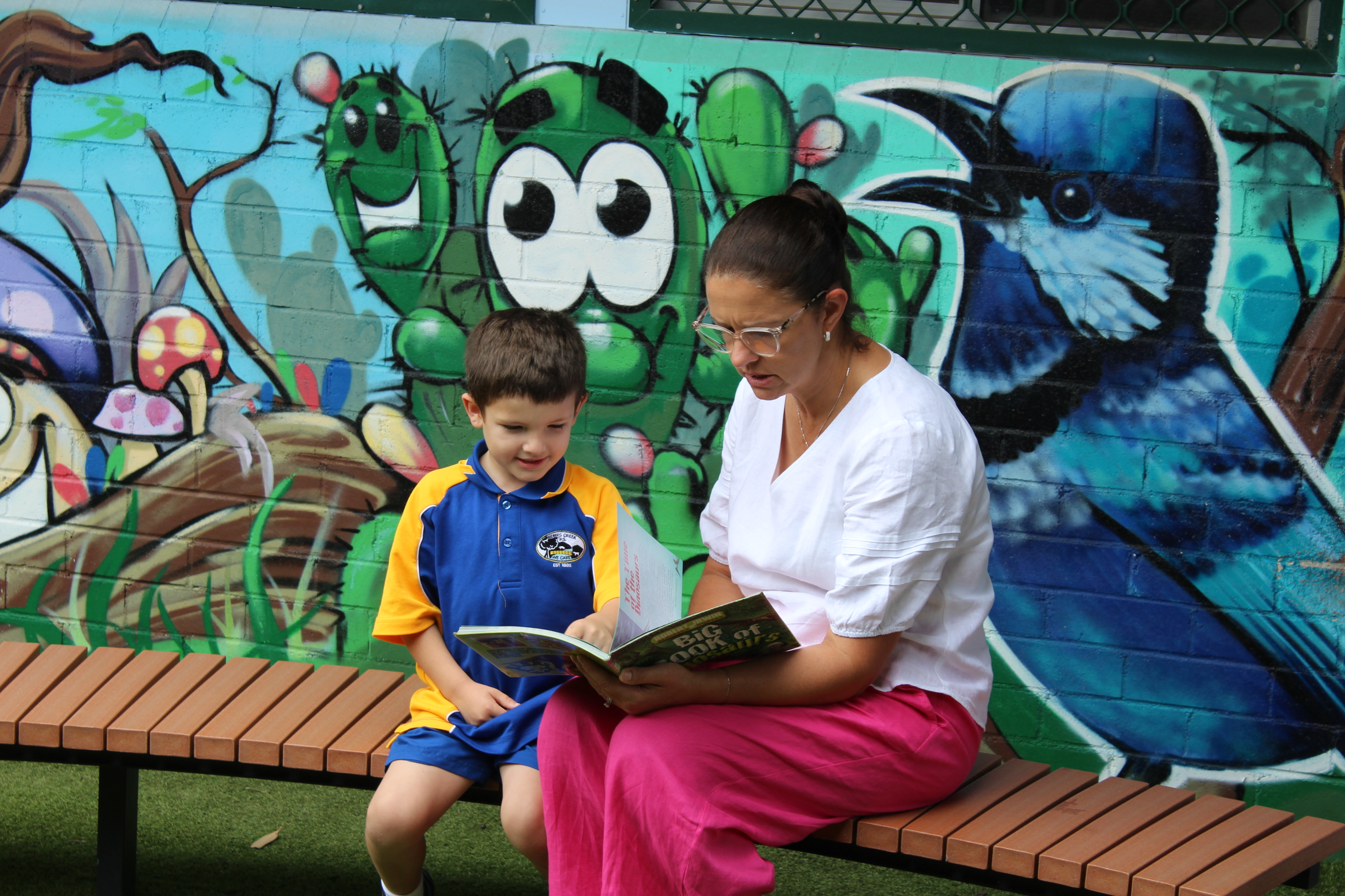 Student and Teacher reading together